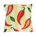 Watercolor red chili peppers and green leaves on a pale yellow and cream striped outdoor pillow