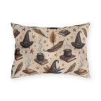 Witch hats, cauldrons, spell books and gold stars on parchment cream outdoor lumbar pillow