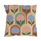 Retro hydrangea outdoor pillow with blue and pink hydrangeas inside terracotta, sage and cream arches