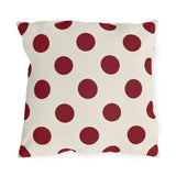 Merlot polka dot outdoor pillow with large deep wine purple dots on cream