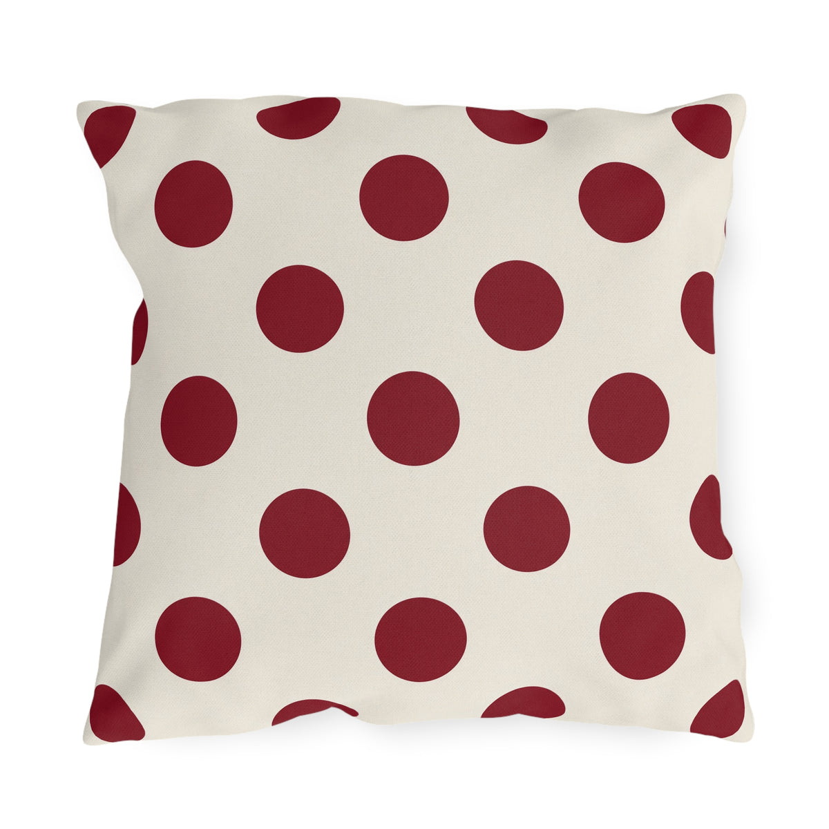 Merlot polka dot outdoor pillow with large deep wine purple dots on cream