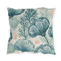 Teal sea fans, kelp and urchins with coral shells on a cream outdoor pillow