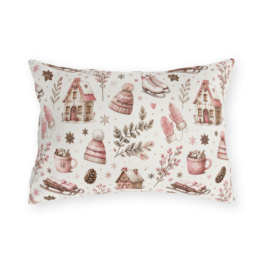 Pink cottages, wooden sleds, ice skates and bobble hats on cream outdoor lumbar pillow