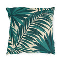 Tropical outdoor pillow with large overlapping teal palm fronds on cream
