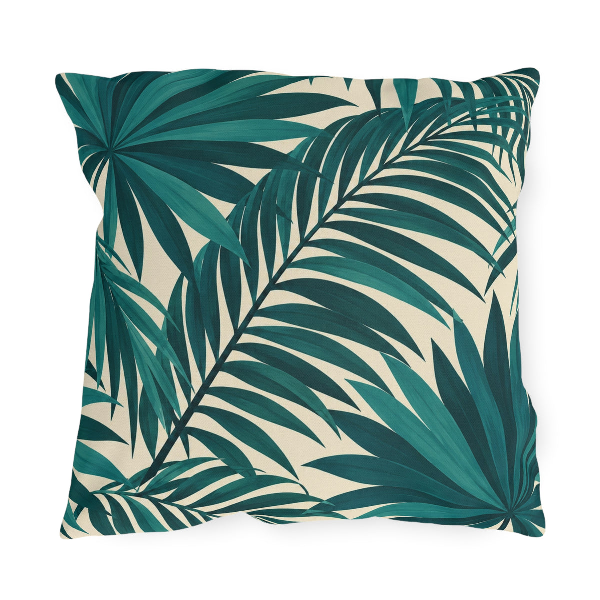 Tropical outdoor pillow with large overlapping teal palm fronds on cream