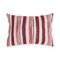 Cranberry and rose painted stripes on a cream outdoor lumbar pillow