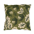 Acorns and oak leaves in forest green and cream on a mossy olive outdoor pillow