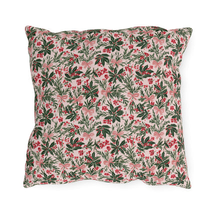Holly, pine, red berries and pink bows on blush outdoor pillow