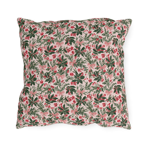 Holly, pine, red berries and pink bows on blush outdoor pillow