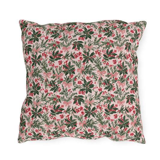 Holly, pine, red berries and pink bows on blush outdoor pillow