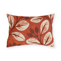 Cream leaves and dark rosehips block printed on a burnt terracotta outdoor lumbar pillow