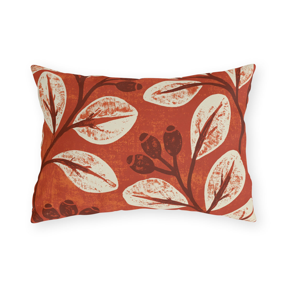 Cream leaves and dark rosehips block printed on a burnt terracotta outdoor lumbar pillow