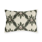 Pine sprays and white berry clusters in a symmetrical lattice on a cream outdoor lumbar pillow