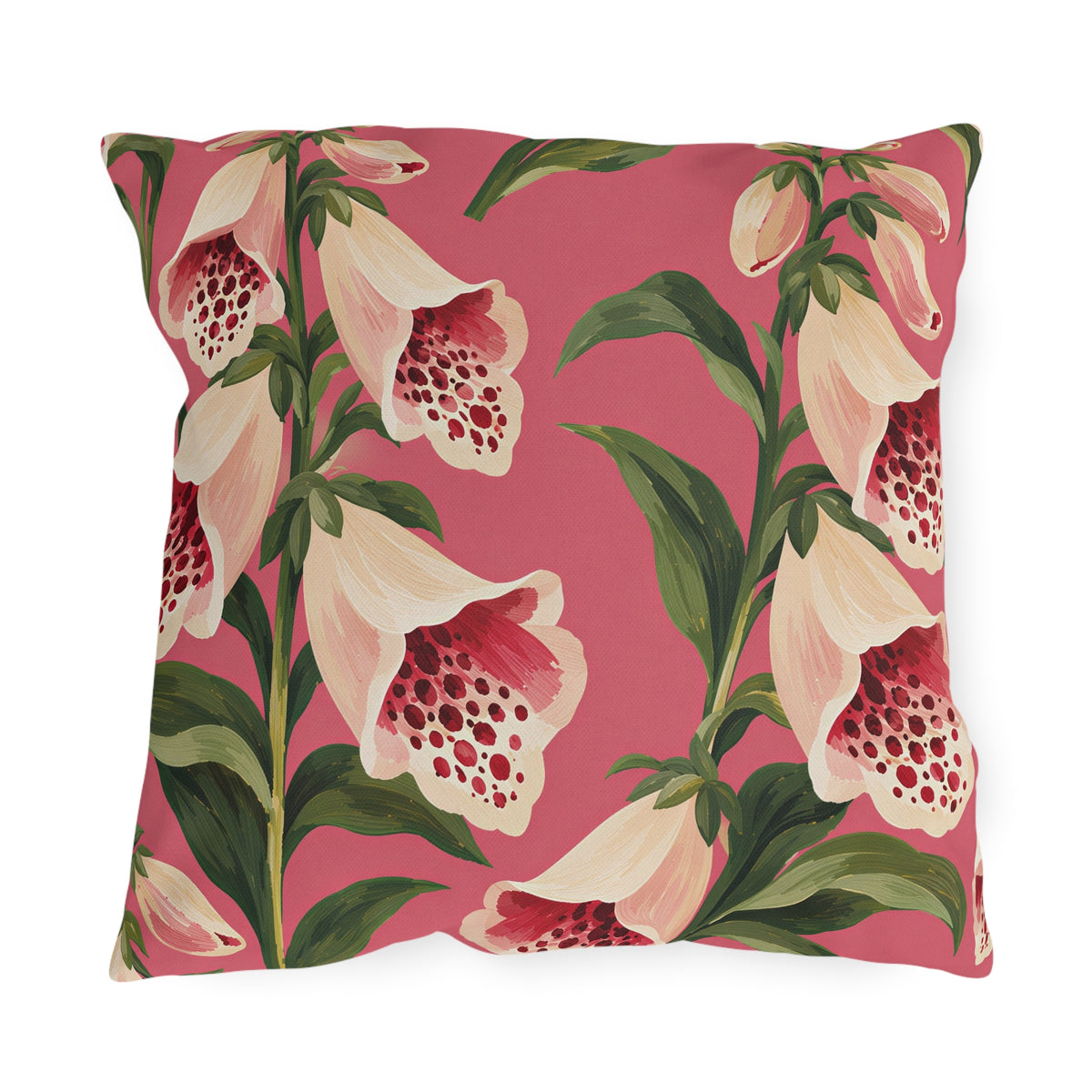 Floral outdoor pillow with painted cream foxgloves speckled in crimson and green leaves on rose pink