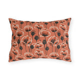 Coral poppies and black seed heads on terracotta outdoor lumbar pillow