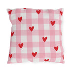 Light pink gingham outdoor pillow with small red hearts