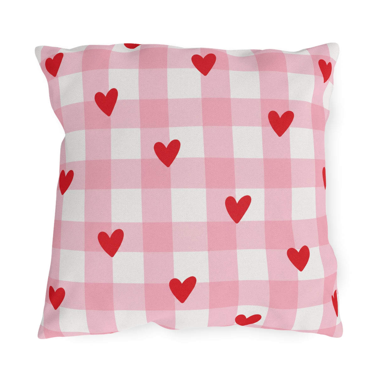 Light pink gingham outdoor pillow with small red hearts