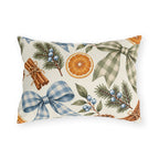 Christmas outdoor lumbar pillow with watercolor blue and sage gingham bows, dried orange slices, cinnamon sticks, pinecones and pine on cream