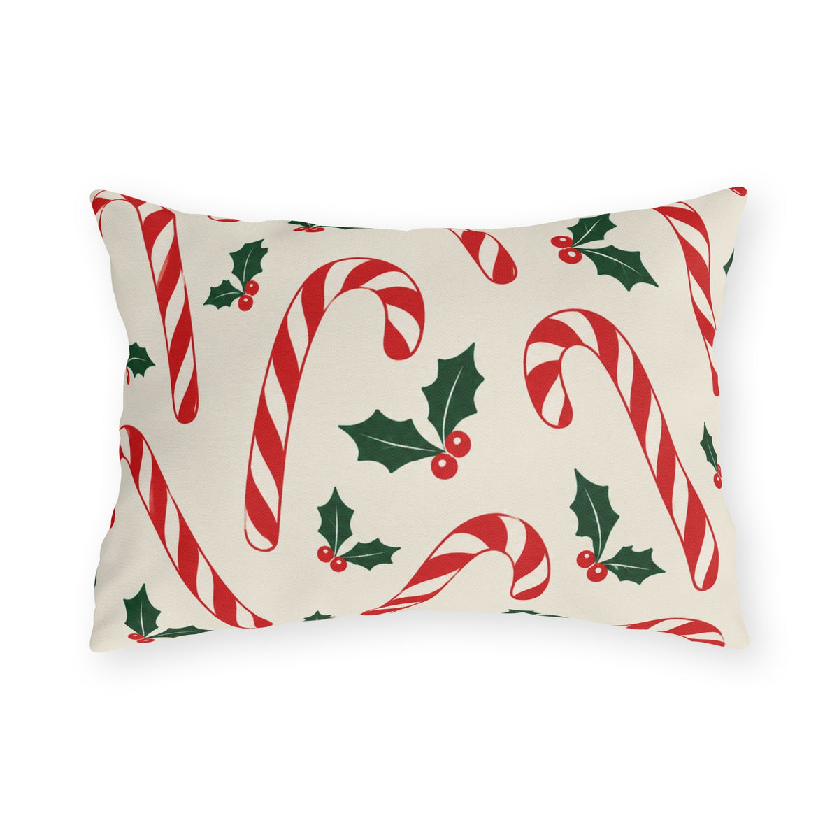Christmas outdoor lumbar pillow with red and white candy canes and holly on cream