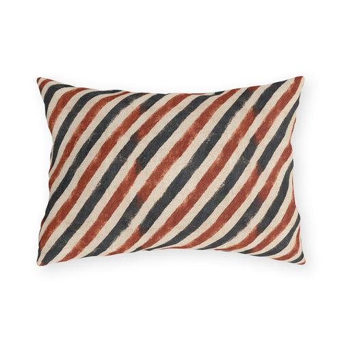 Diagonal rust and charcoal block-printed stripes on cream outdoor lumbar pillow