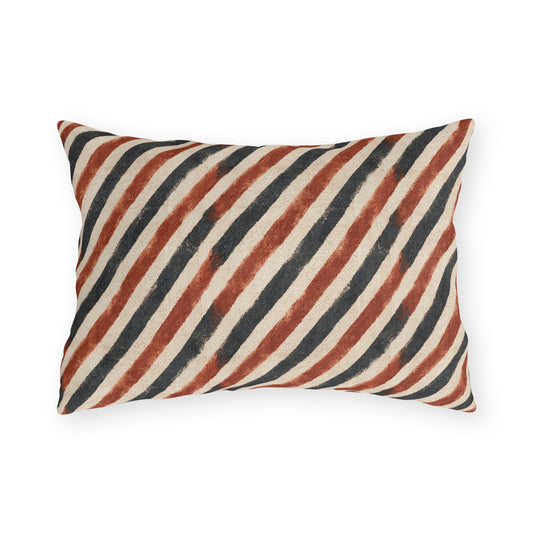 Diagonal rust and charcoal block-printed stripes on cream outdoor lumbar pillow