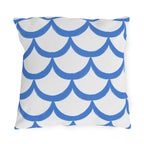 Blue outdoor pillow with hand-painted cornflower blue scallops in overlapping rows on white