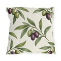 Green and purple olives on branches over a cream outdoor pillow