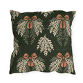 Cream cedar fronds and terracotta bows on a near-black forest green outdoor pillow