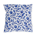 Scattered cobalt blue tulips and vines on a white outdoor pillow