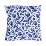 Scattered cobalt blue tulips and vines on a white outdoor pillow