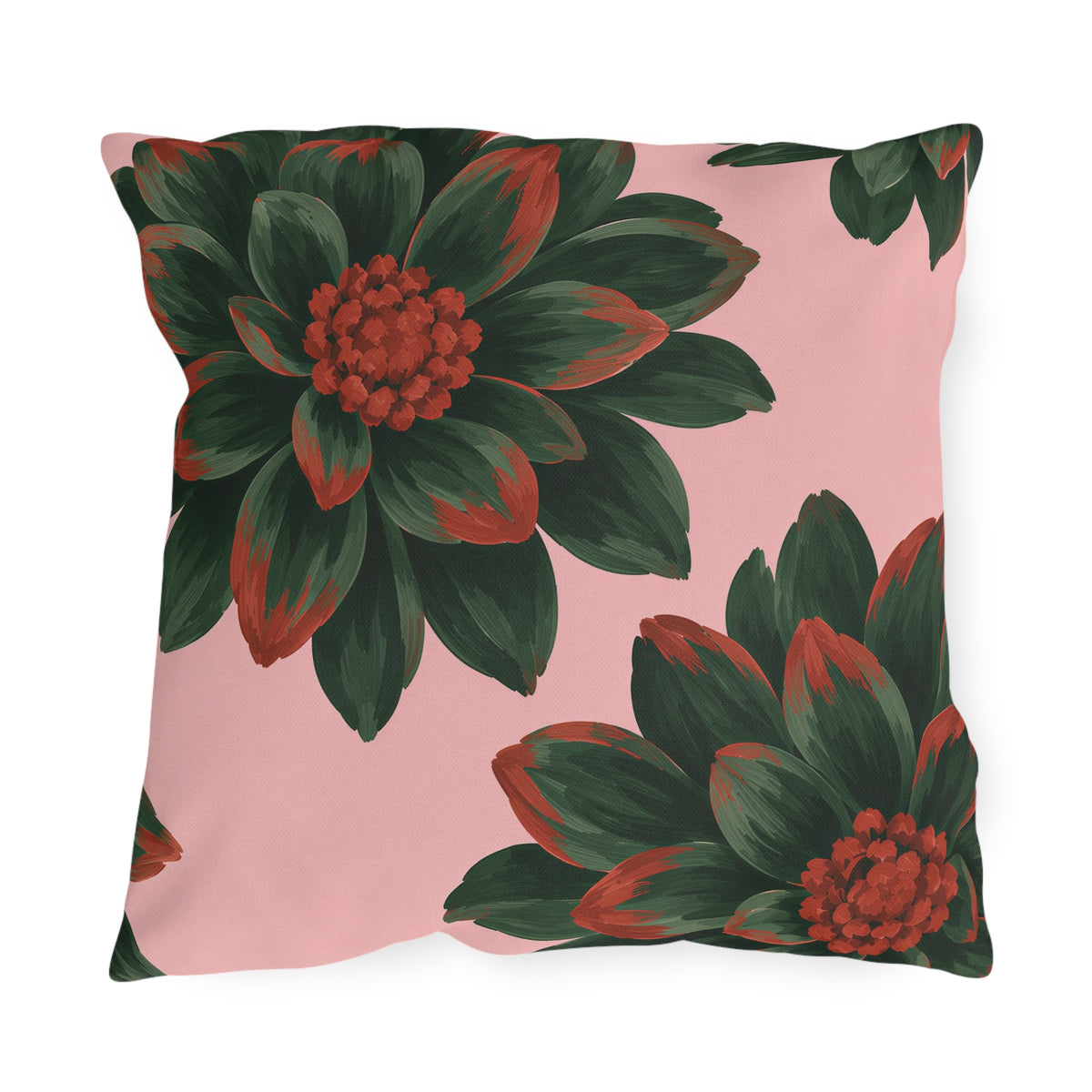 Floral outdoor pillow with oversized dark green dahlias tipped in rust red on blush pink
