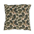 Deep green oak leaves and acorns on cream outdoor pillow