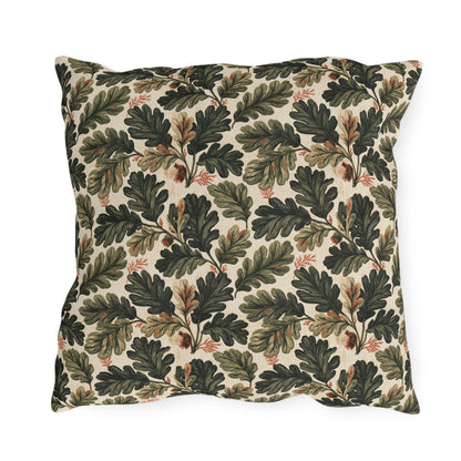 Deep green oak leaves and acorns on cream outdoor pillow
