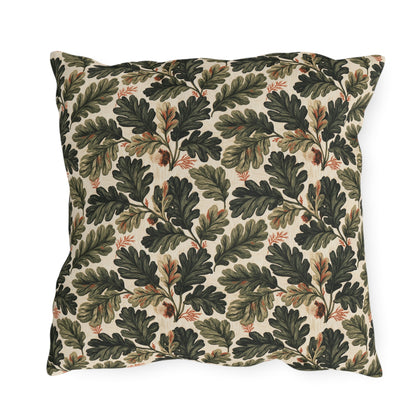 Deep green oak leaves and acorns on cream outdoor pillow