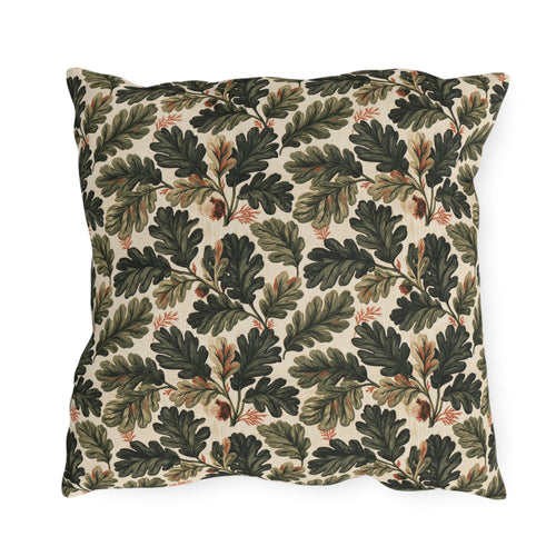 Deep green oak leaves and acorns on cream outdoor pillow