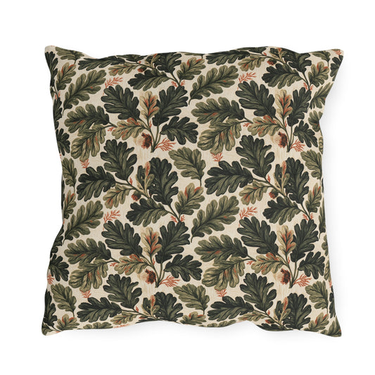 Deep green oak leaves and acorns on cream outdoor pillow