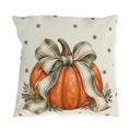 Orange pumpkin with a sage striped bow and oak leaves on a cream polka dot outdoor pillow