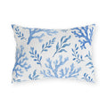 Coastal outdoor lumbar pillow with painted blue sea coral branches and seaweed sprigs on white