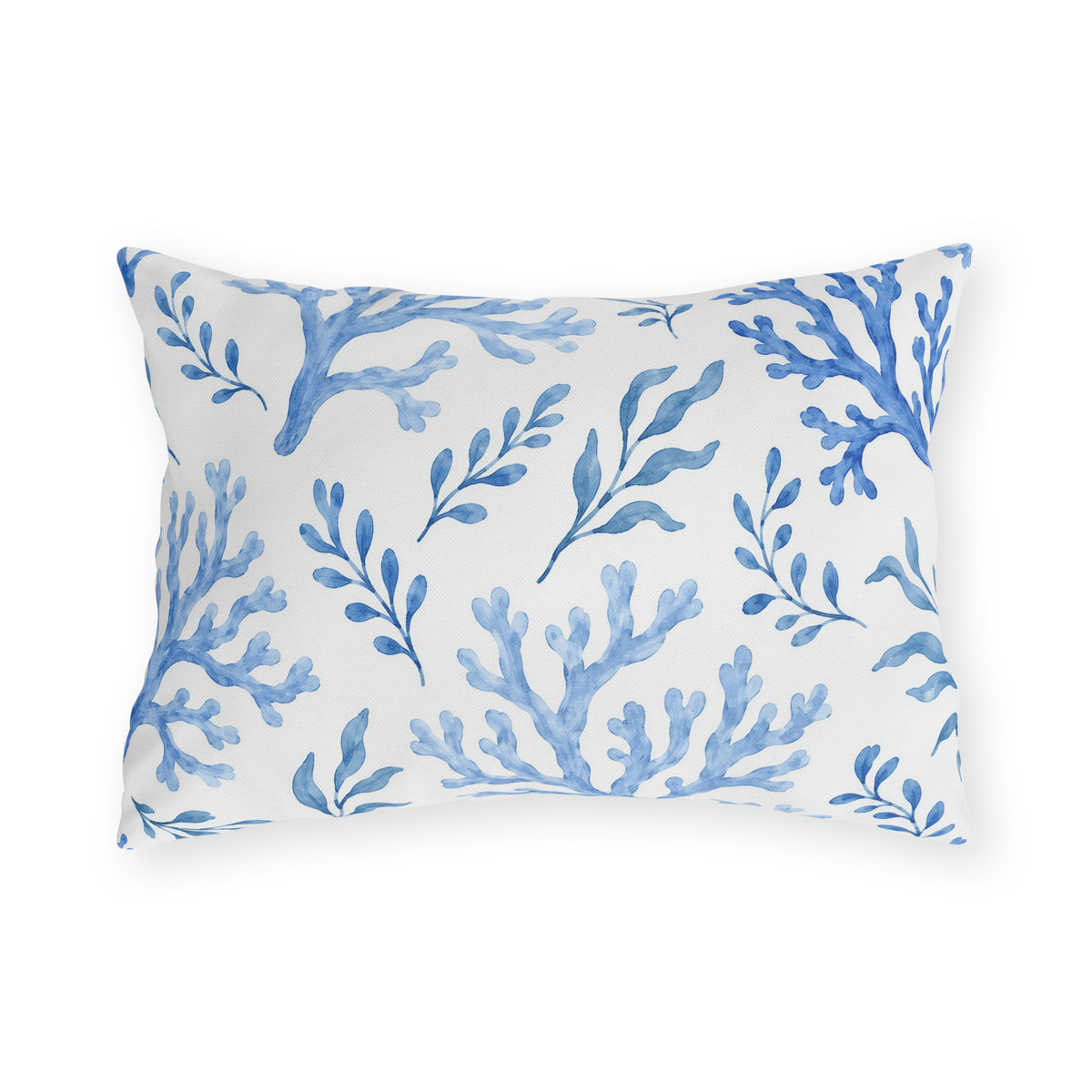 Coastal outdoor lumbar pillow with painted blue sea coral branches and seaweed sprigs on white