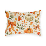 Fall outdoor lumbar pillow with watercolor orange and cream pumpkins, maple leaves, berries and gingham bows on cream