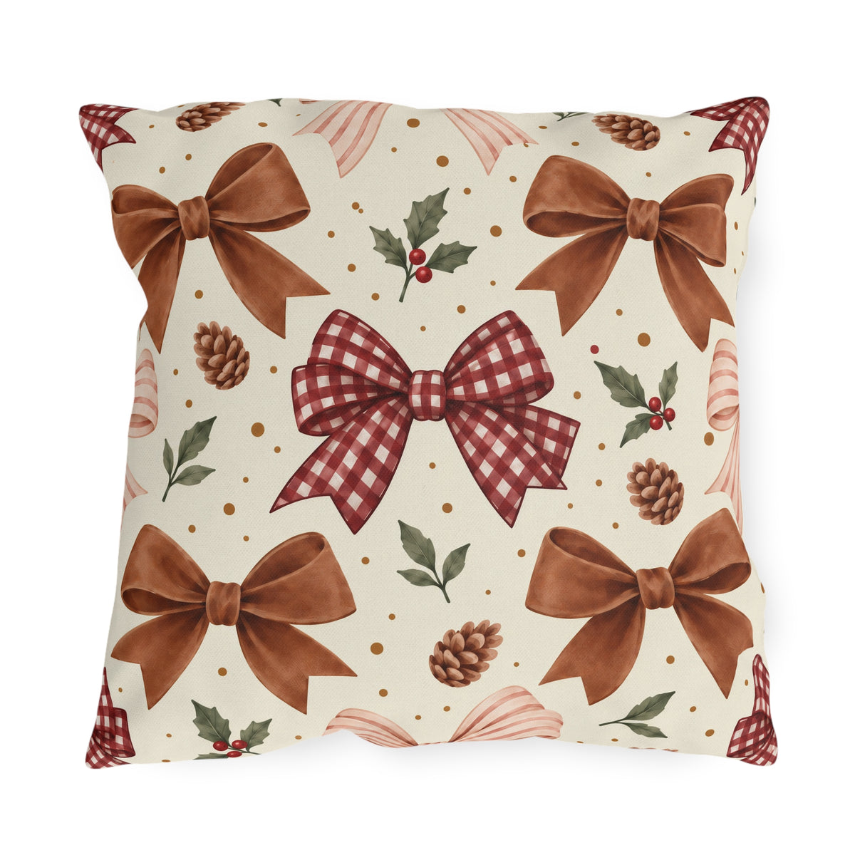 Christmas outdoor pillow with watercolor brown satin bows, red gingham bow, pinecones and holly on cream