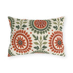 Block print floral outdoor lumbar pillow with folk flower medallions in terracotta and sage green with leafy sprigs on cream