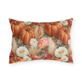 Orange pumpkins, cream chrysanthemums and wheat on warm brown outdoor lumbar pillow