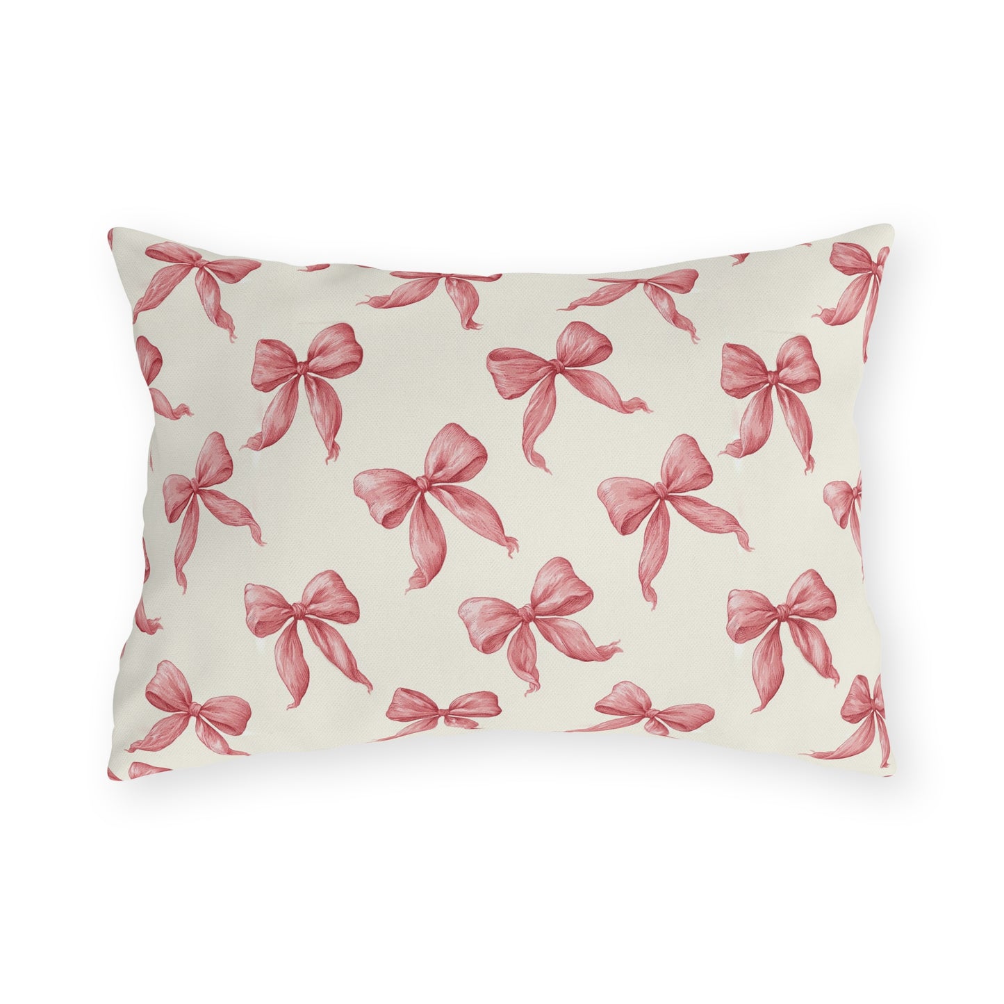 Rose pink engraved ribbon bows scattered on cream outdoor lumbar pillow