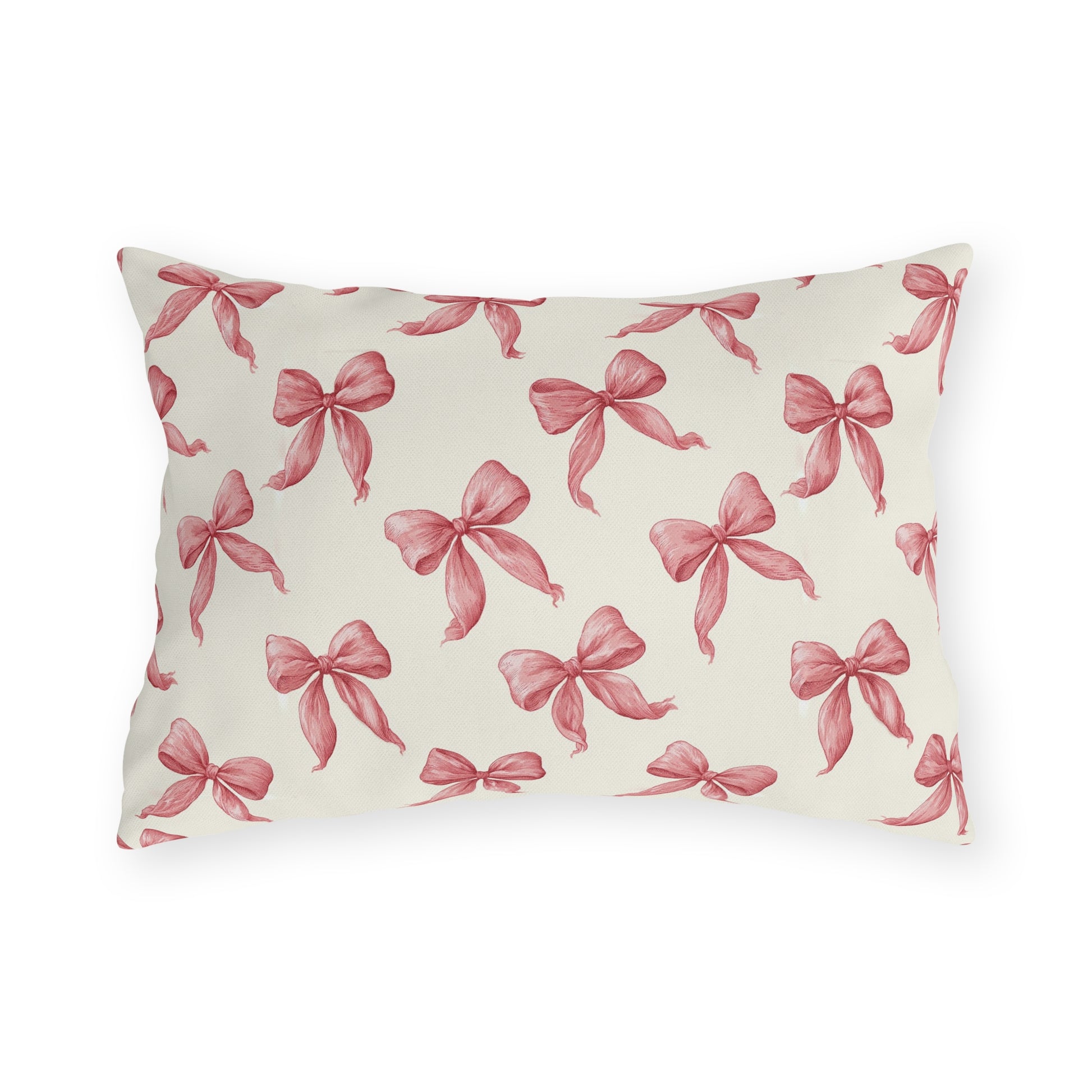 Rose pink engraved ribbon bows scattered on cream outdoor lumbar pillow