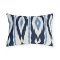 Navy and white ikat stripe outdoor lumbar pillow with feathered navy bands and light blue accents