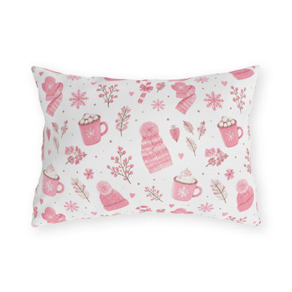 Pink beanies, mittens, cocoa mugs and snowflakes on white outdoor lumbar pillow