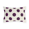 Aubergine polka dot outdoor lumbar pillow with large deep purple dots on cream