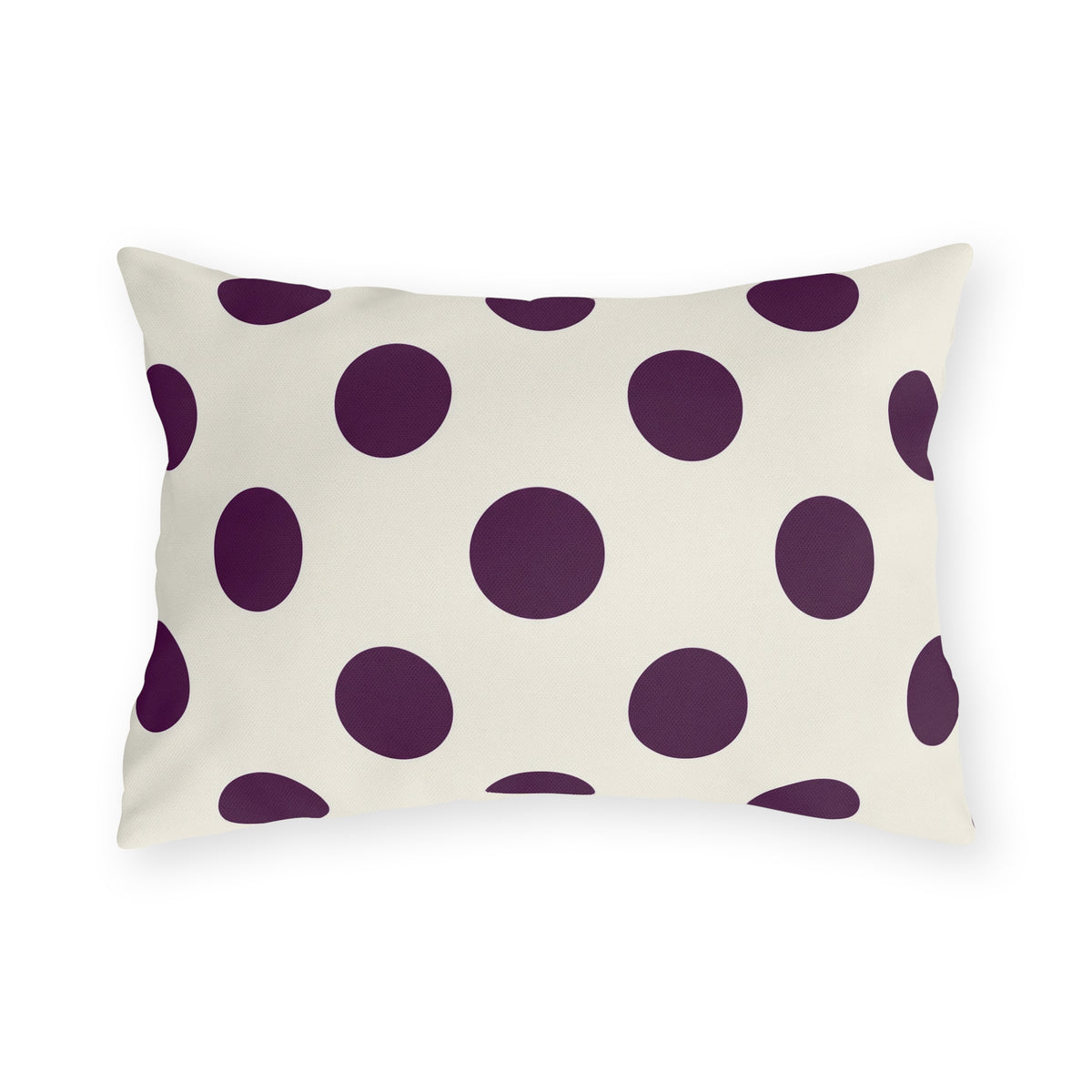 Aubergine polka dot outdoor lumbar pillow with large deep purple dots on cream
