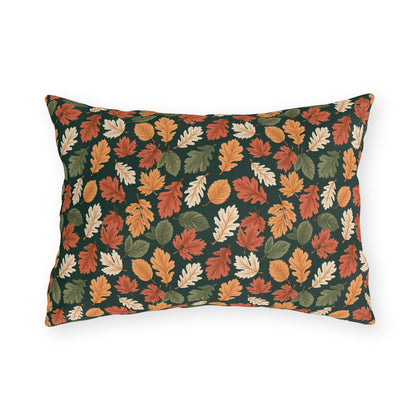 Rust, orange and cream autumn leaves on forest green outdoor lumbar pillow